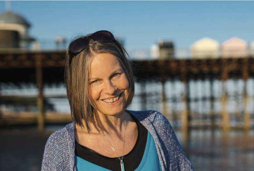 Portrait of Nicky Torode smiling on the seafront