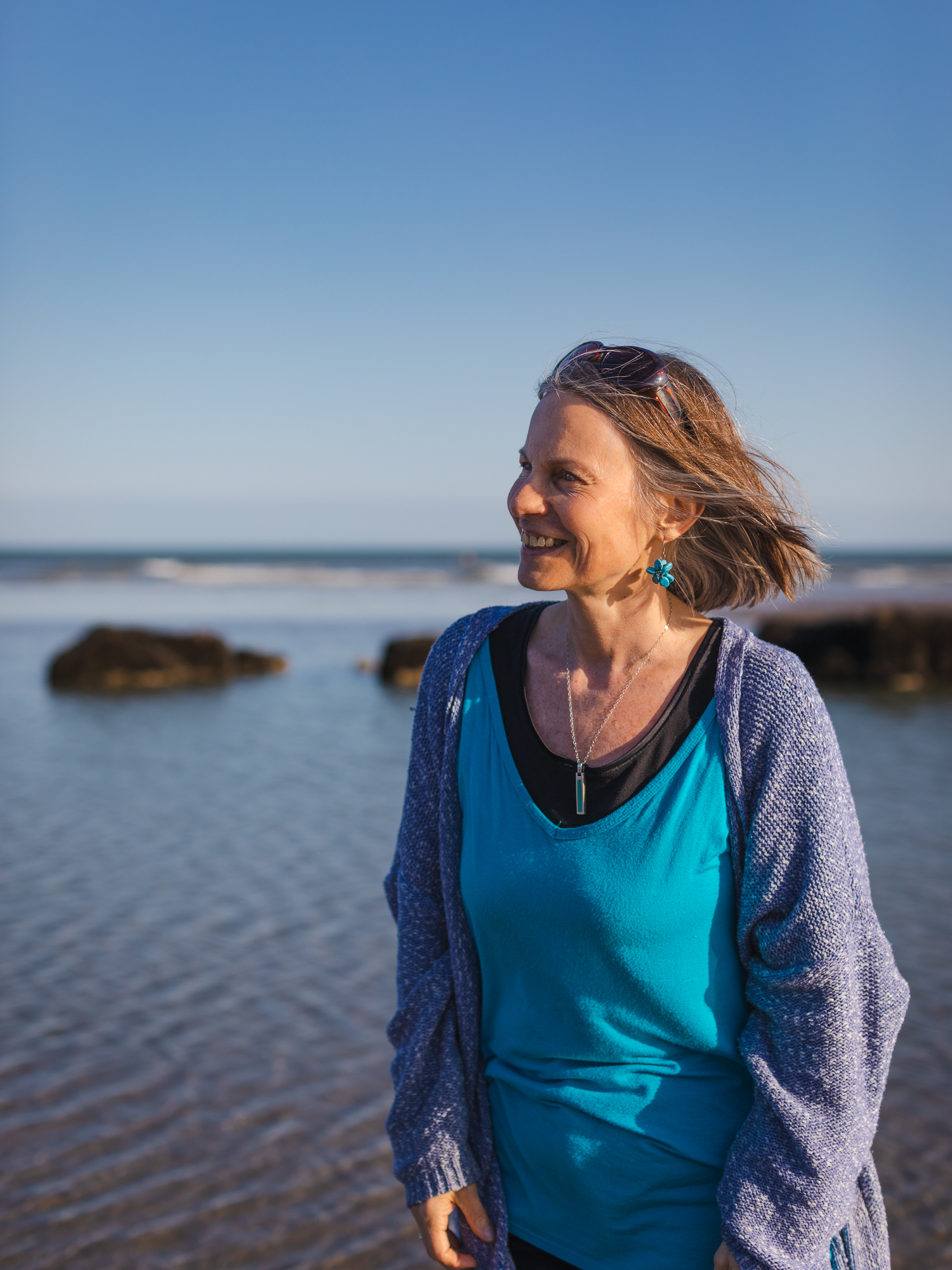 Nicky Torode on the beach looking out to sea