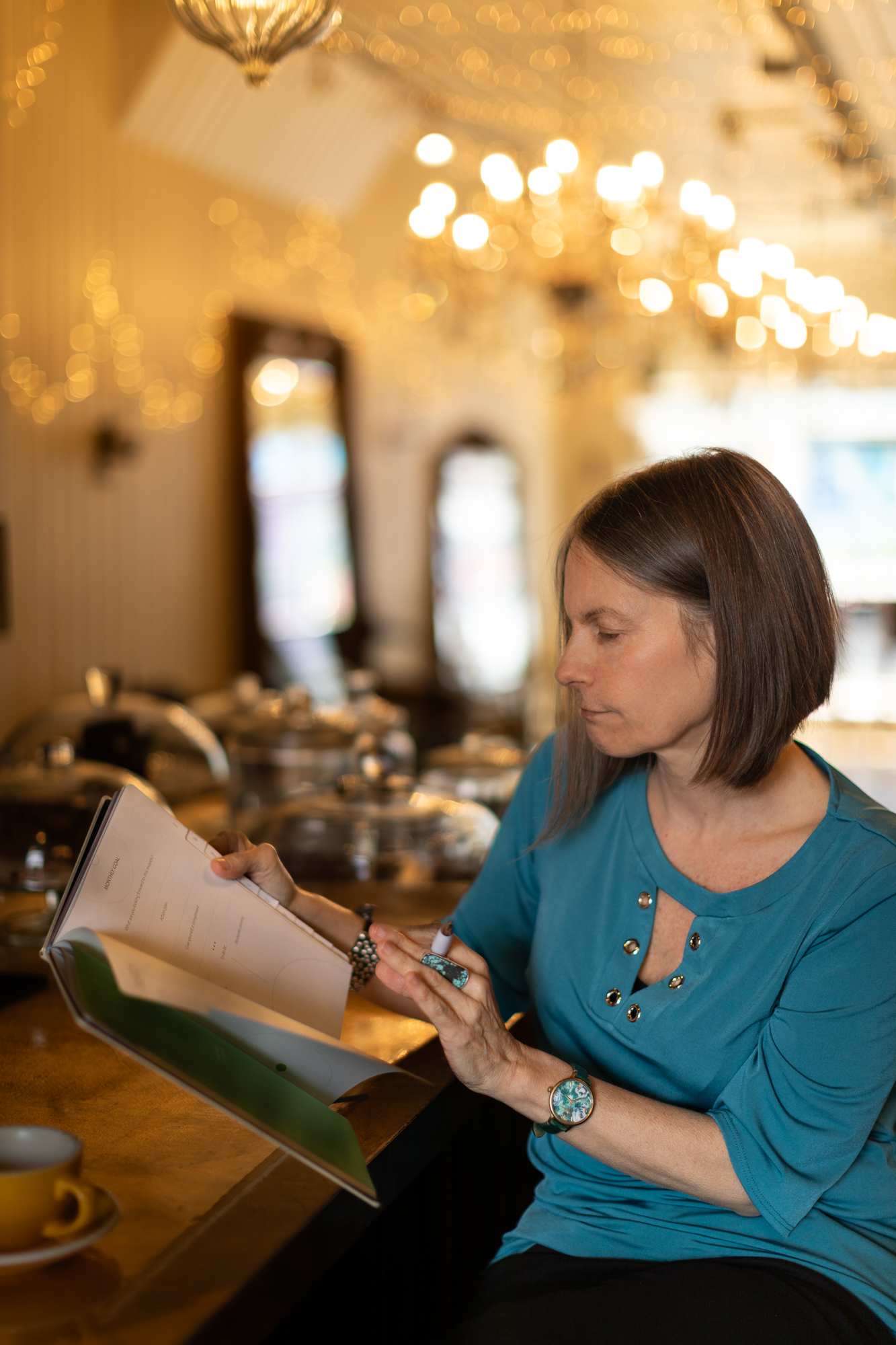 Nicky Torode reading through a reflective journal